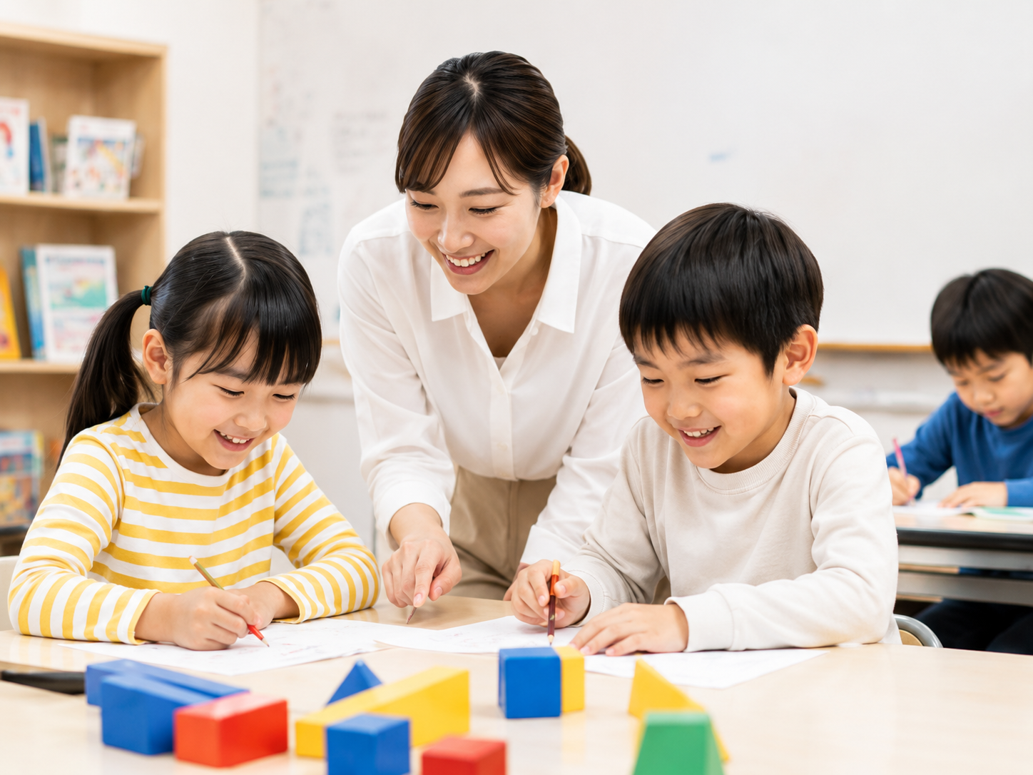 先生と一緒に算数を学ぶ子どもたち